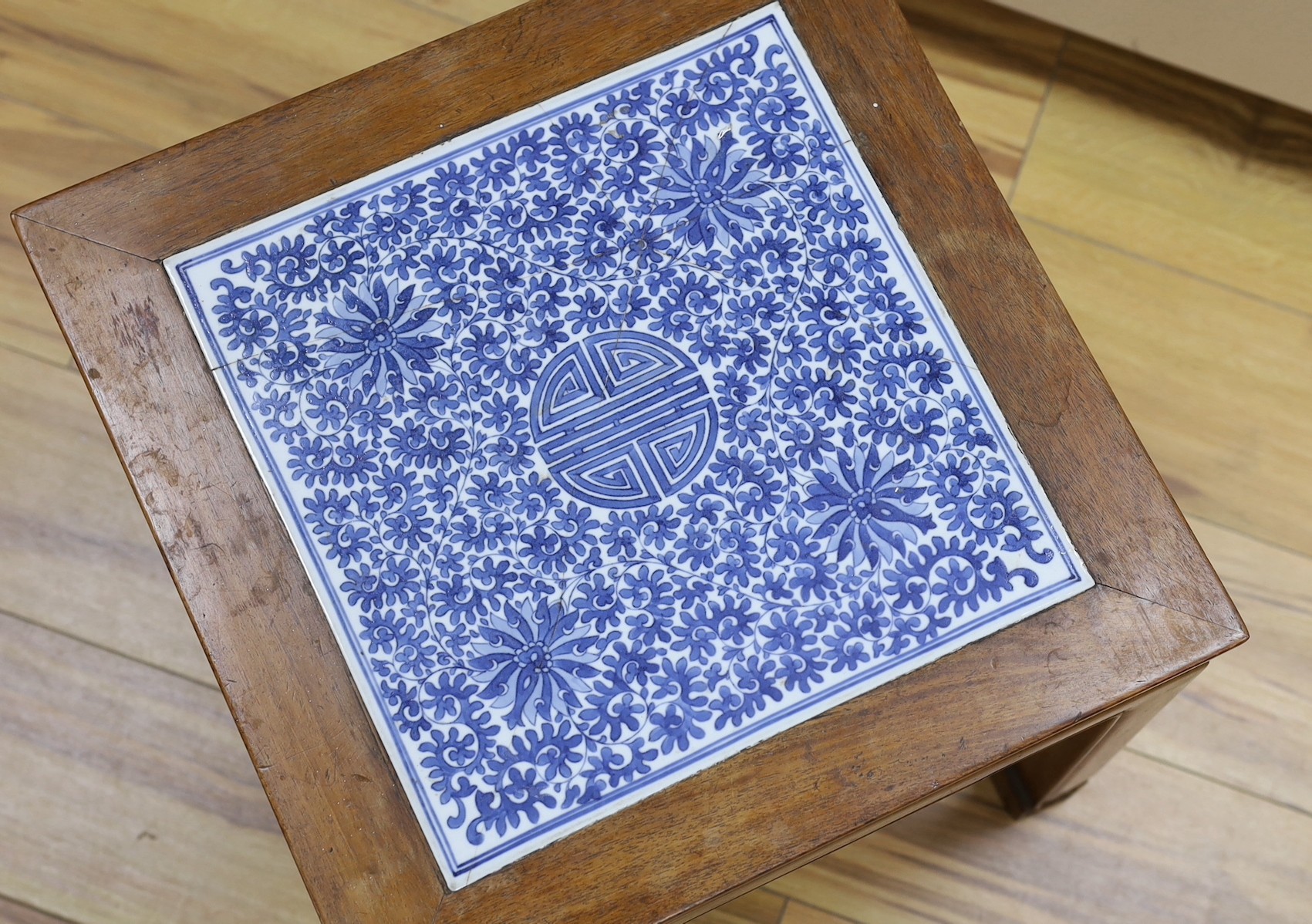 A Chinese hardwood and blue and white porcelain inset table, 42cms square